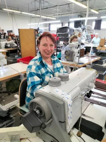 Lyudmila at her leather stitching station at the Fourès workshops