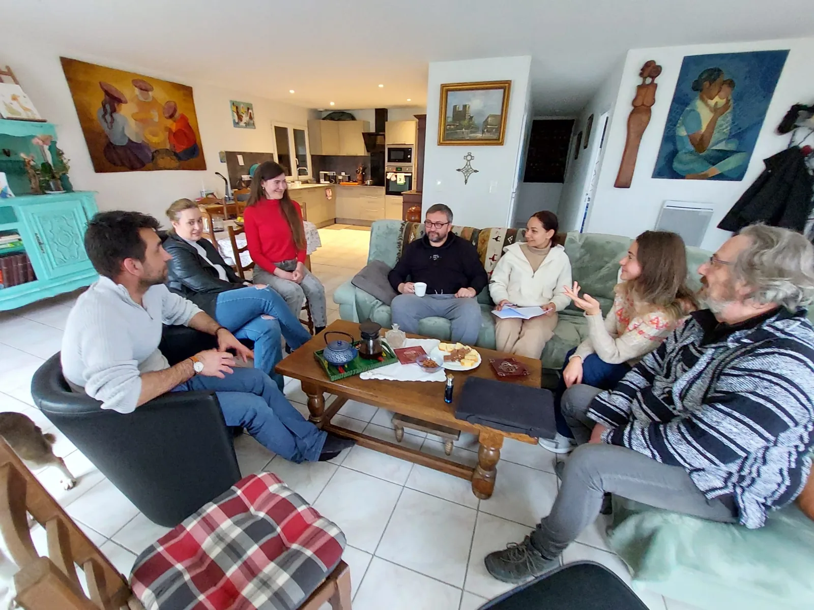 A meeting of the speaking club, around a coffee table